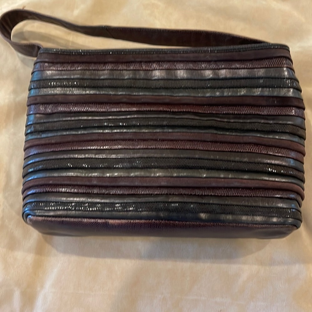 Dark brown leather and suede Sharif handbag with zipper closure.